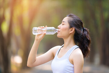 Young Asian woman and a bottle of water