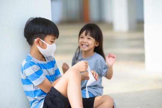 Boy and girl wear mask