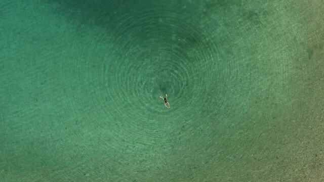 Aerial view of a girl swimming in Adriatic Sea, Brijuni National Park, Croatia