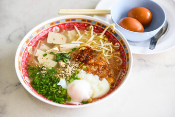 Asian food - Spicy noodle with pork vegetable and egg Thai food soup bowl