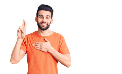Young handsome man with beard wearing casual t-shirt smiling swearing with hand on chest and...