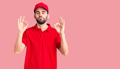 Young handsome man with beard wearing delivery uniform relaxed and smiling with eyes closed doing...