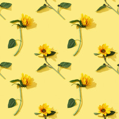 Seamless regular pattern from beautiful sunflower on yellow paper. Natural autumn flowers.