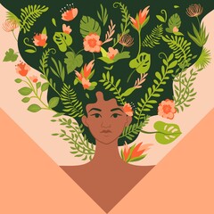 Strong woman with flowers and plants weaving through her hair
