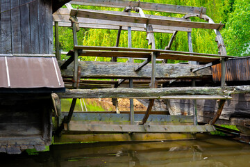 water mill and fountain with scale in the farm yard