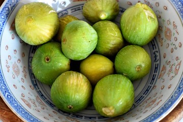 Fresh green figs in a bowl/ Mediterranean healthy fruit 