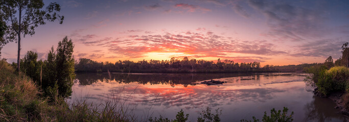 Beautiful Riverside Sunrise Panorama with Reflections