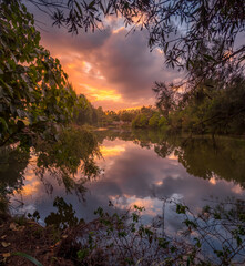 Beautiful Lakeside Sunrise with Cloud Reflections