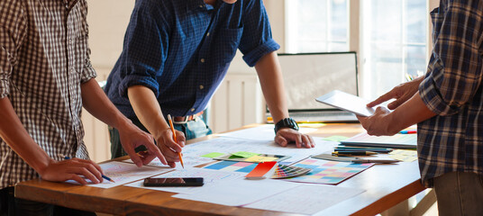 Design groups brainstorm their creativity to draw and design website and app layouts.