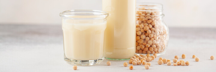 Vegetable pea milk in a bottle and peas in a jar. Gluten free, lactose free product