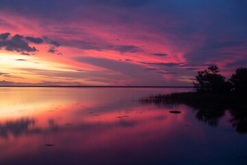 Fototapeta na wymiar Beautiful sunset at lake Ibera with reflections on the water