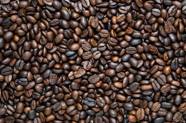 Background of dark roasted coffee beans. Food
