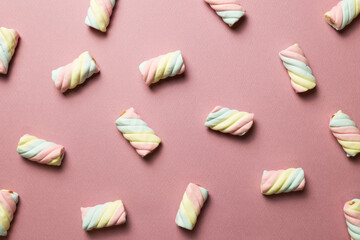 Colorful marshmallow on pink background. flat lay, top view. Delicious snacks pattern background