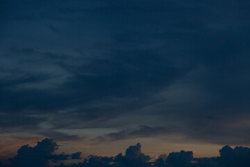 Beautiful sunset sky above clouds with dramatic light