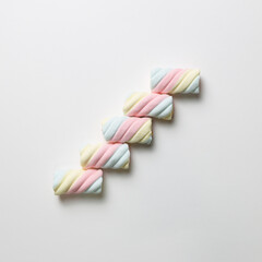 Stairs. Colorful marshmallow on white background. flat lay, top view