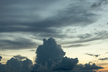 Beautiful sunset sky above clouds with dramatic light