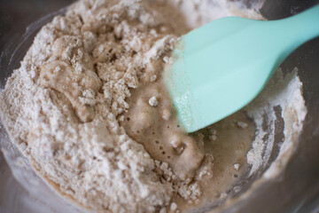 stirring rye flour and water