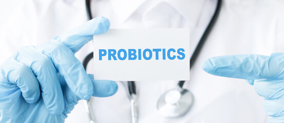 Doctor holding a card with text Probiotics medical concept