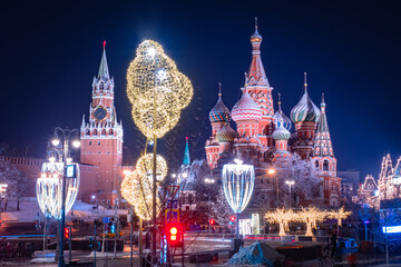 Panorama of Moscow. Sights of Russia. Moscow Kremlin on Red Square. St. Basil's Cathedral. New Year's decorations in center of Moscow. Night before Christmas in capital. Traveling in Russia.