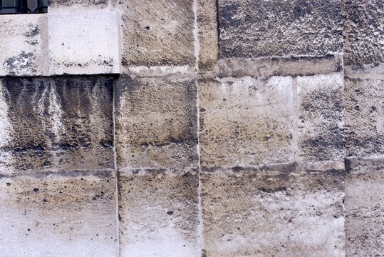 A View Of An Ancient Or A Very Old Wall Of Rural Area Made Up Of Different Sizes Of Bricks And Also Diverse In Colors And Burn Marks On Wall Is Also There