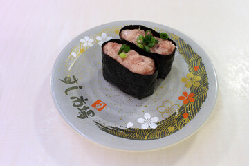 Plate of couple of sushi roll at restaurant