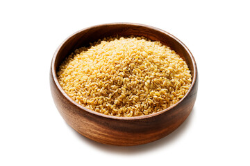 Raw bulgur in wooden bowl. Healthy gluten free product. Concept of healthy eating. Organic wheat grains product. isolated on white background