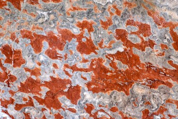 A ruined marble wall with some red paint splash over it