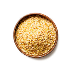 Raw bulgur in wooden bowl. Healthy gluten free product. Concept of healthy eating. Organic wheat grains product. isolated on white background
