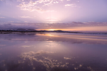 Fototapeta na wymiar Sunset at Famara beach, in Lanzarote, Canary Islands, Spain