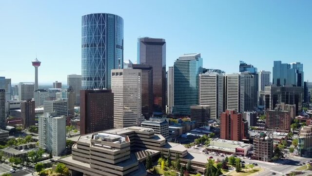 Aerial: Calgary city skyline and buildings in summer