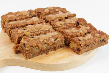 a healthy apple peanut butter oatmeal bar for breakfast. healthy food. already cut into pieces 