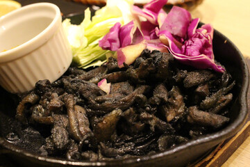 Black charcoal fried chicken at Japanese izakaya