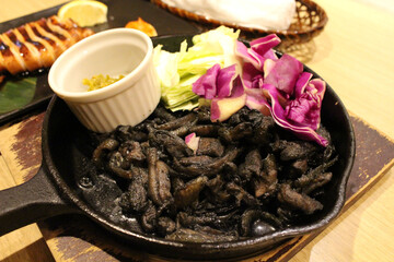 Black charcoal fried chicken at Japanese izakaya