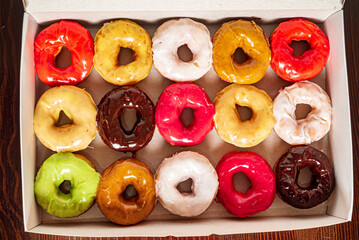 Collection of many colored donuts in a box