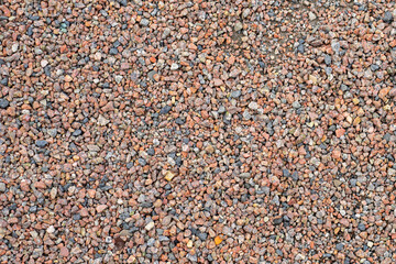 Small pebble stone material groaund texture.