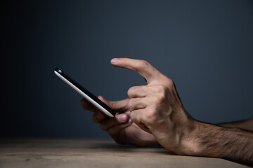 businessman holds tablet in hand