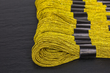 skeins of golden embroidery threads