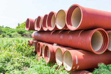 front circular view of ductile iron pipes stocked in open space go-down.
- 381074650