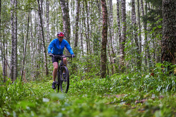 Fototapeta premium Men is riding on bicycle.