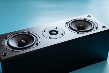 Closeup of black premium loudspeaker for music and home theater system with color mood and tone style