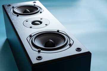 Closeup of black premium loudspeaker for music and home theater system with color mood and tone...