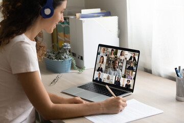 Close up of smiling female employee have webcam digital virtual conference meeting with multiracial...