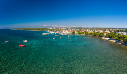 Panoramic aerial drone picture over the Istrian town of Fazana with harbour during daytime