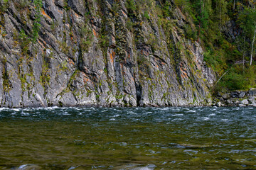 The rock in the middle of the mountain river