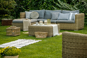 Beautiful summer day in elegant home garden with trendy furniture
