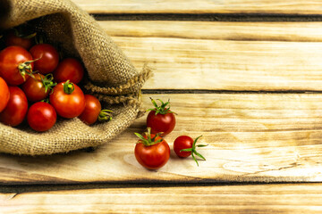 Tomatoes on wood background