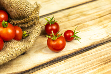 Tomatoes on wood background