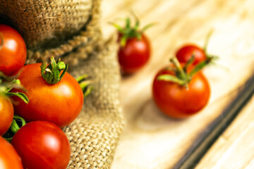 Tomatoes on wood background