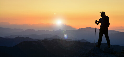 magnificent sunset, mountain climber watching, diving in peace