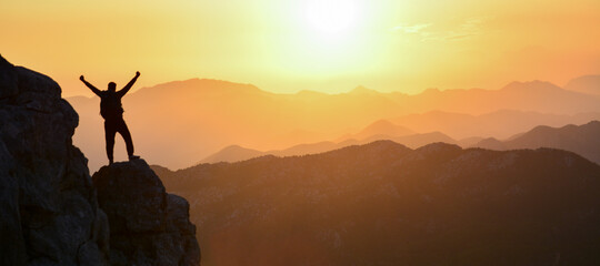 magnificent sunset, mountain climber watching, diving in peace